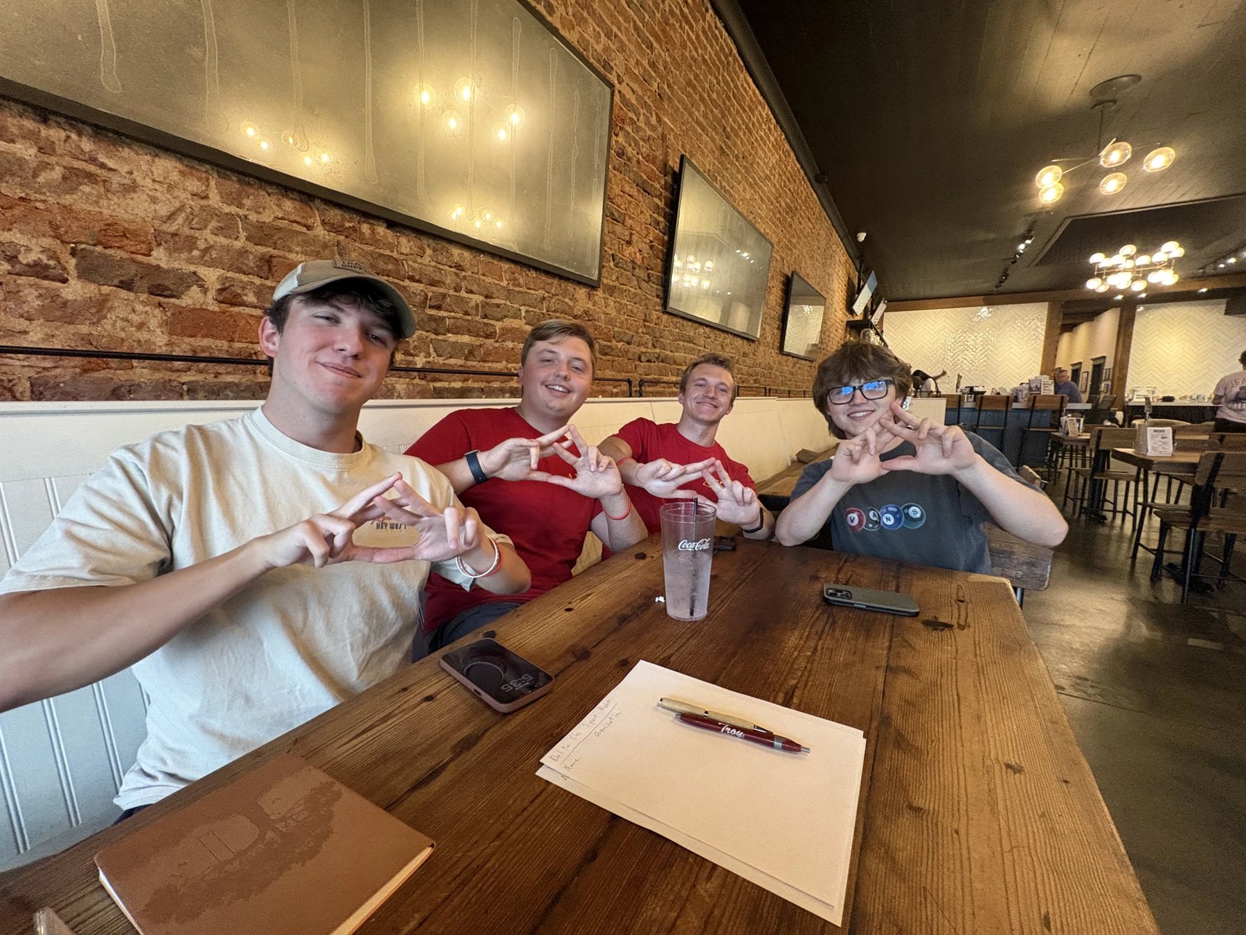 Troy Delta Chi brothers at a chapter meeting